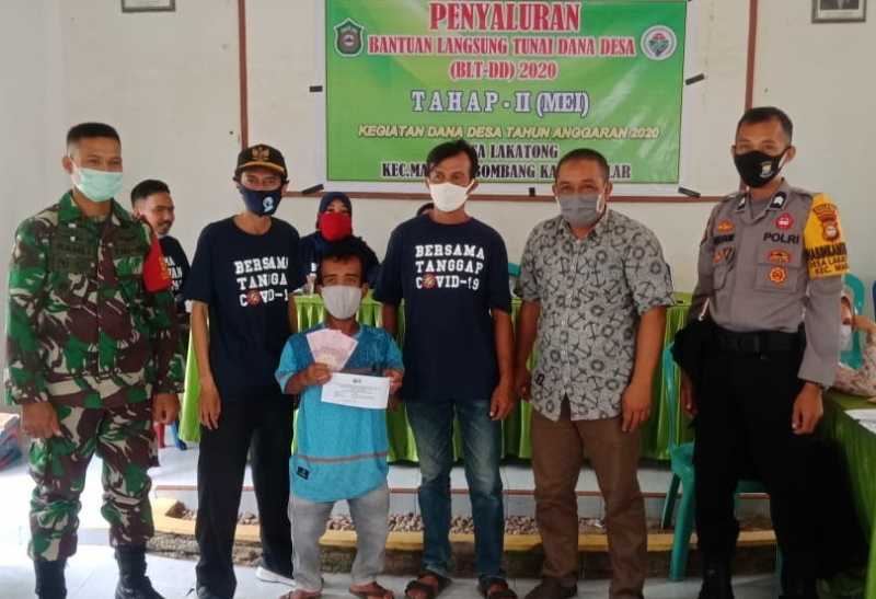 Bhabinkamtibmas Desa Lakatong Pantau Penyaluran Dana Desa Tahap-II