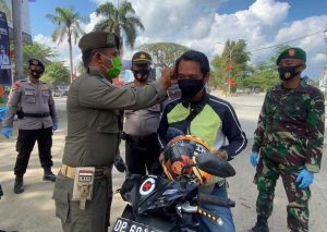 Polres Lutra Apel Bersama Pendisiplinan Pemakaian Masker
