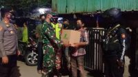 bdfaaca7-ec56-4c05-90c1-be309c30918f Polres Pelabuhan Bersama TNI Berpatroli Skala Besar Sambil Bagi Sembako