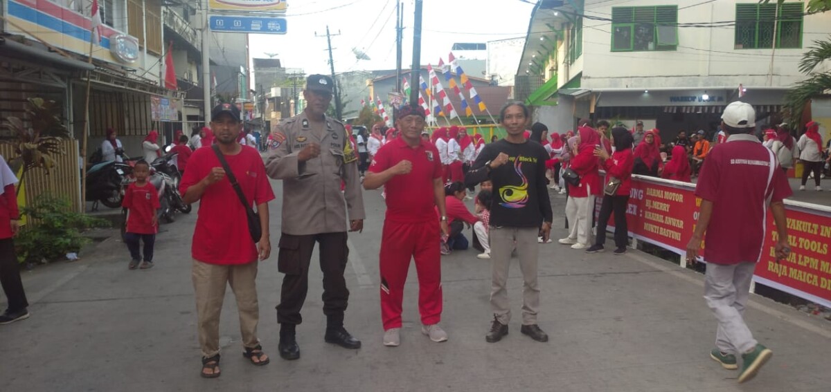 Semangat Kemerdekaan, Bhabinkamtibmas Melayu Hadir Amankan Lomba dan Jalan Santai